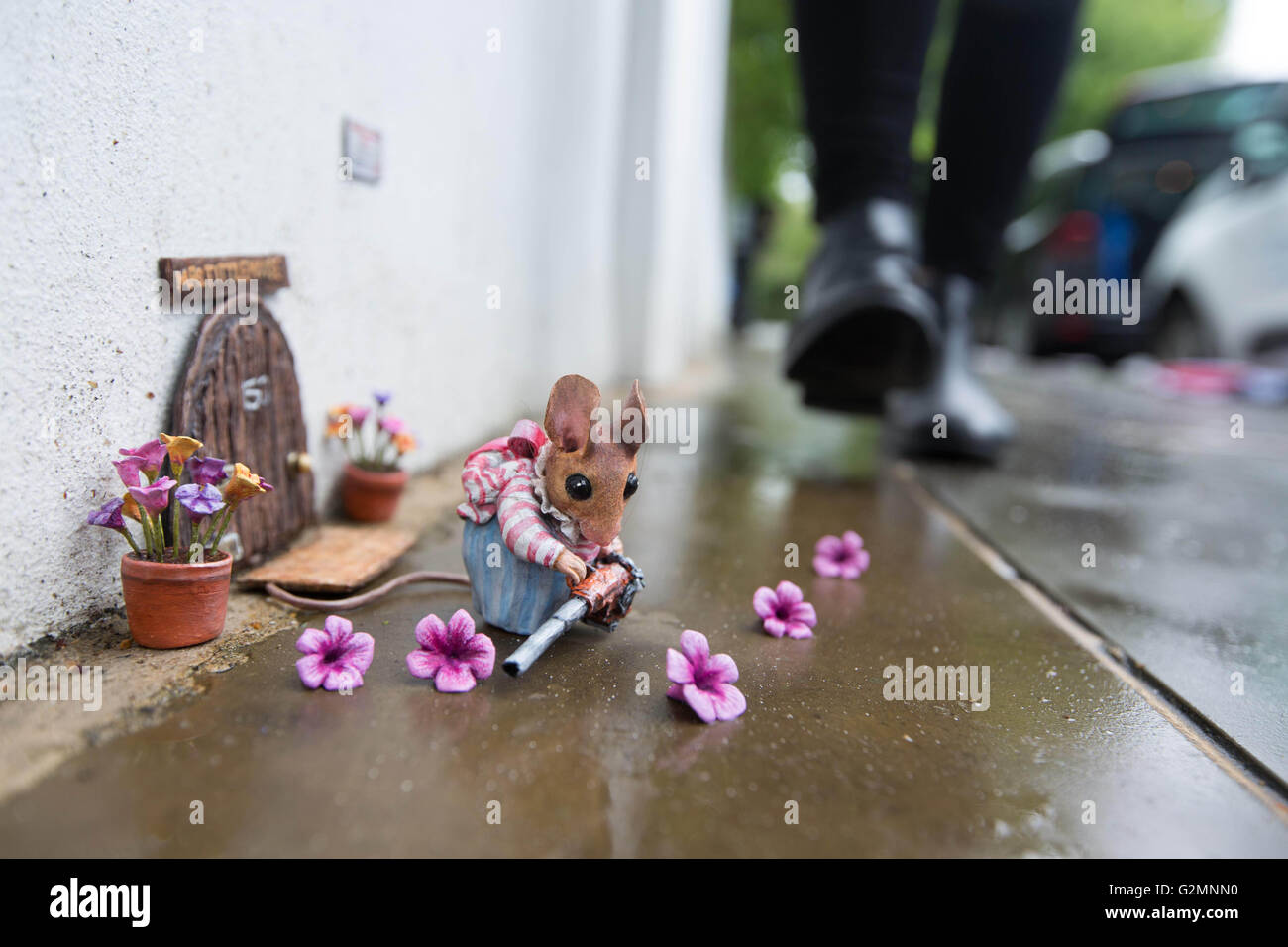 A miniature sculpture of Beatrix Potter character Mrs. Tittlemouse, which has been updated for the 21st Century by street artist Marcus Crocker in celebration of the 150th anniversary of the author's birth, as it is displayed in London. Stock Photo