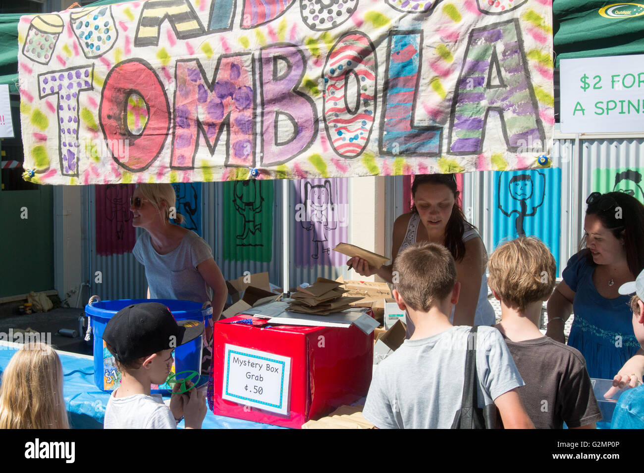 Parents and school children run Tombola stall at a Sydney school fair and fund raising day,Australia Stock Photo