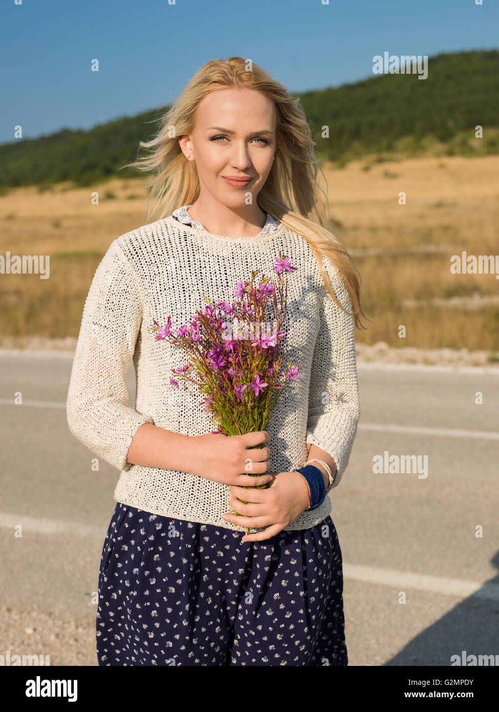 Beautiful woman relaxing outdoors Stock Photo - Alamy