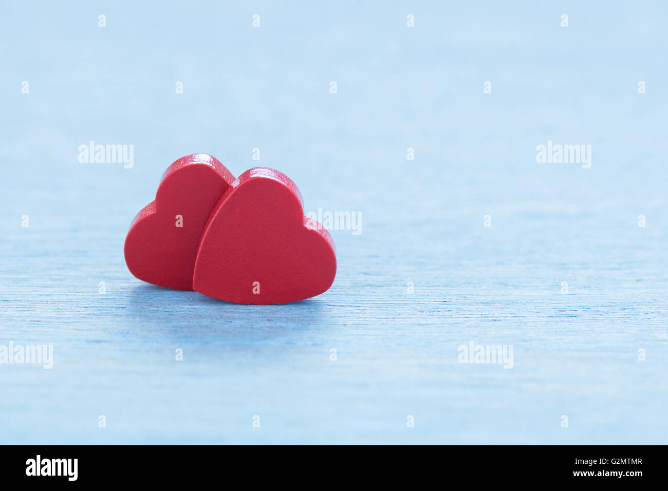 Valentine greeting card or voucher with two red hearts. Stock Photo