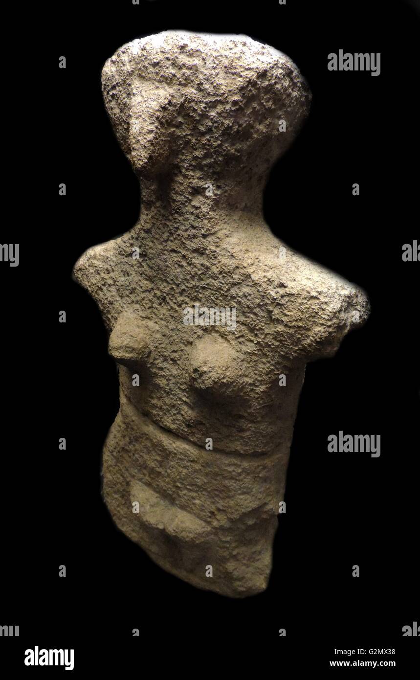 Limestone female figure, possibly late Neolithic 4500-3200 BC. From Karpathos. This figure has some features in common with Cycladic figurines. Stock Photo