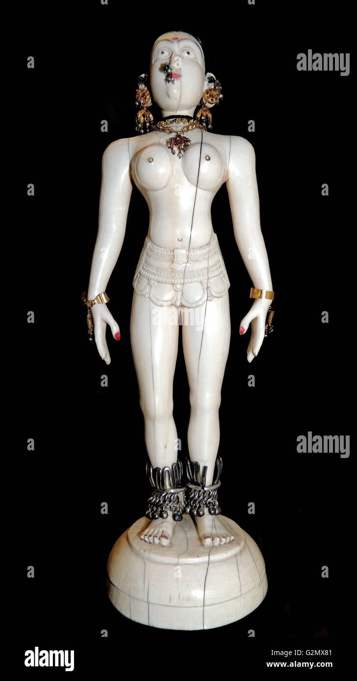 Standing figure. South India, 18th century AD. This ivory figure with metal and textile ornaments may represent a temple dancer. Stock Photo
