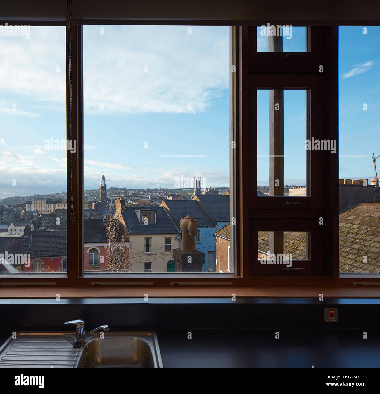 Window view towards city with catholic and protestant churches. St