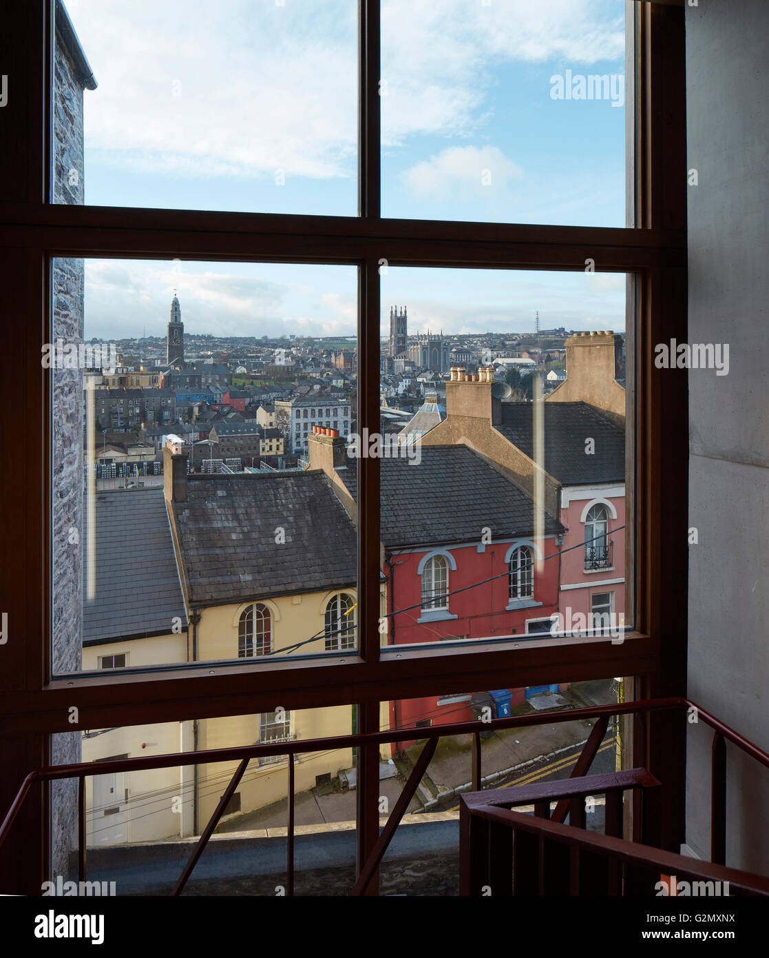 Window view towards city with catholic and protestant churches. St