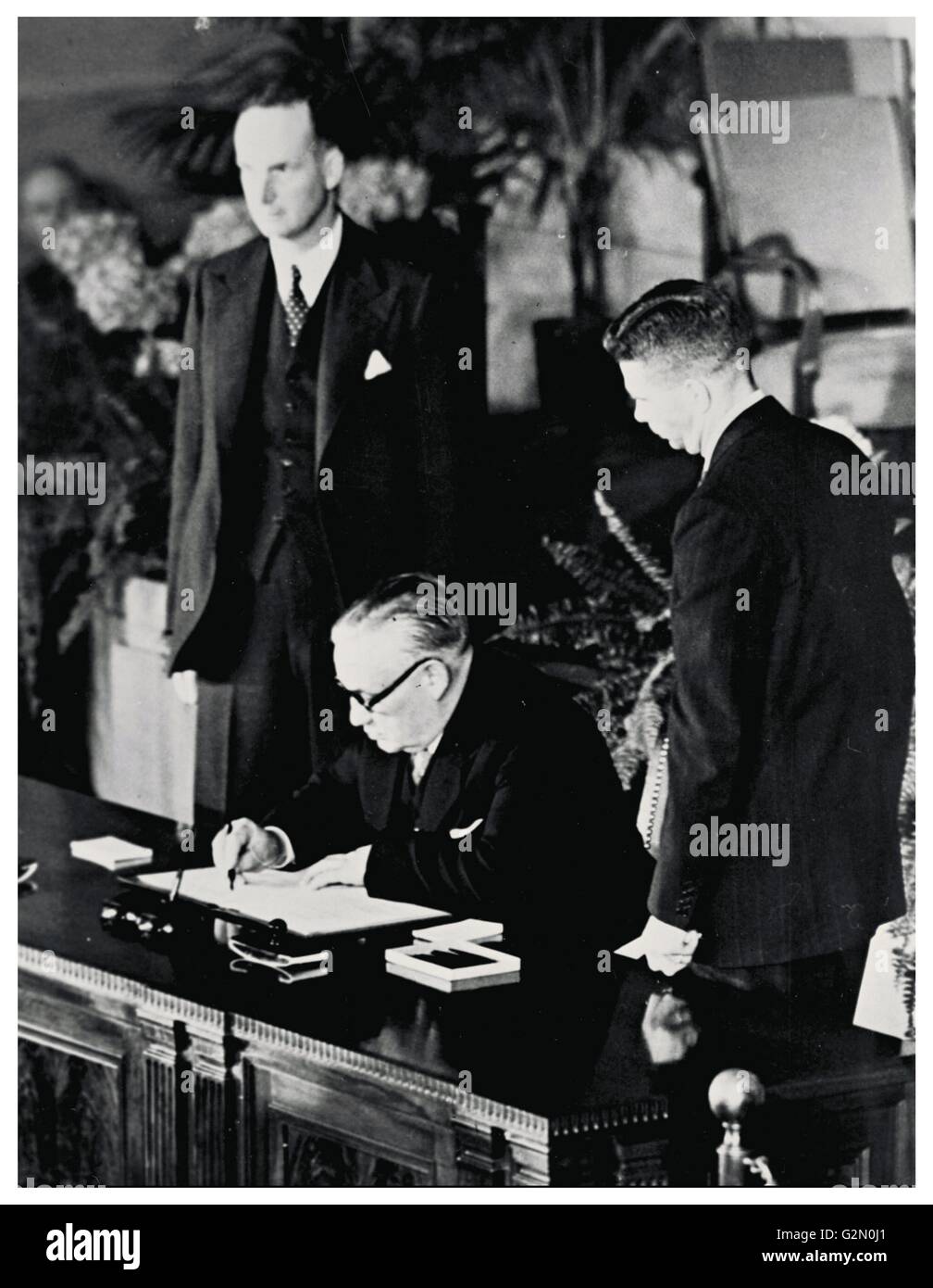 Mr Ernest Bevin (British Minister of Foreign Affairs) signs the NATO Treaty for the United Kingdom. 1949 Stock Photo
