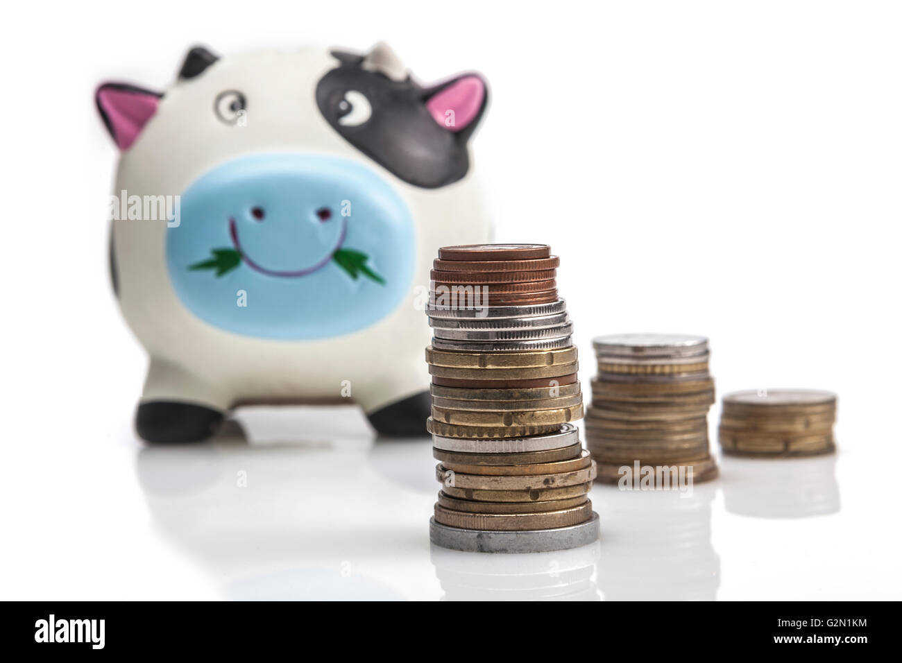 Piggy bank isolated on white background with reflection Stock Photo - Alamy