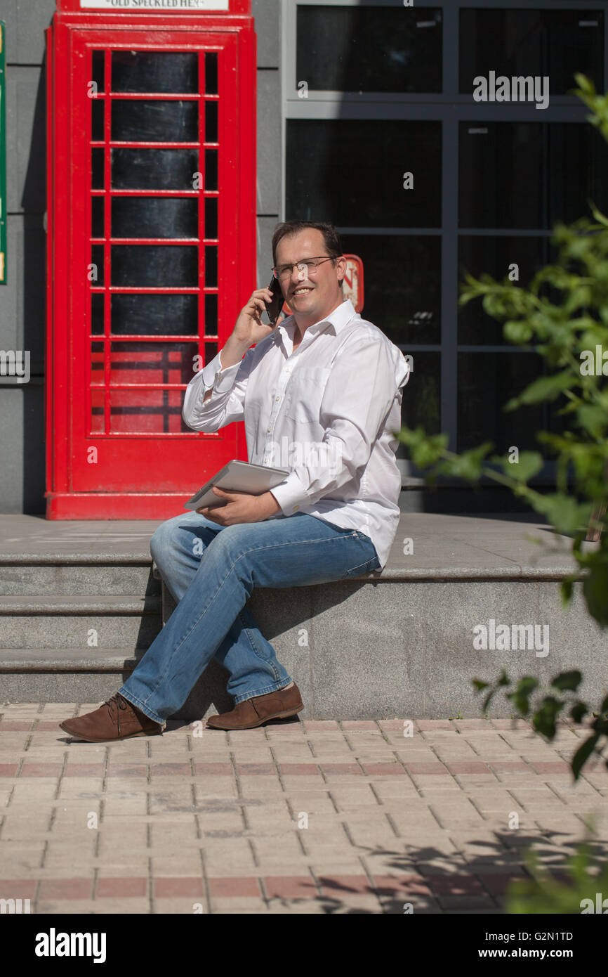 Man Using Red Telephone Person using red telephone box hi-res stock photography and images - Alamy