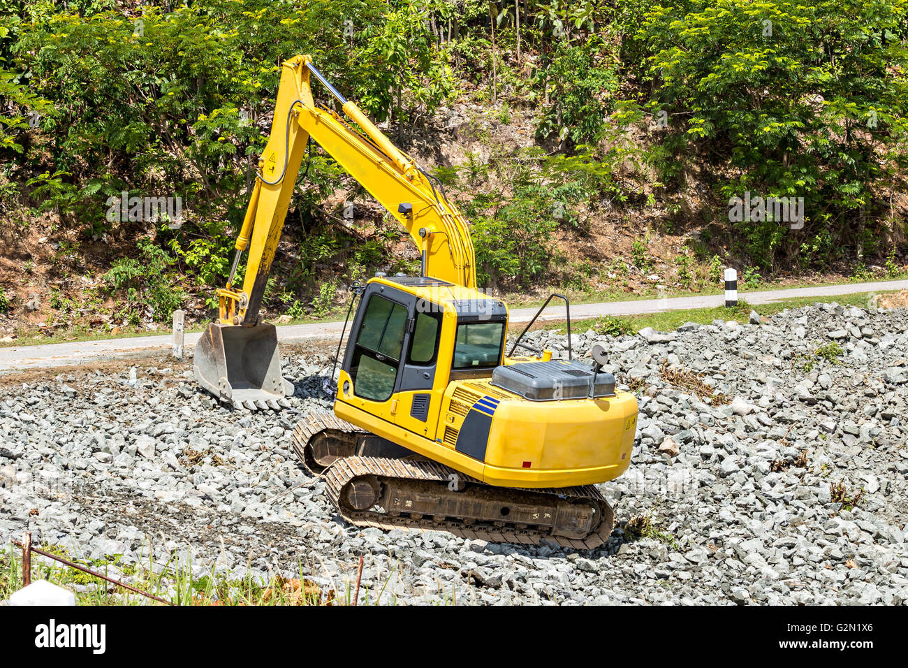 excavator digging rock on constriction site Stock Photo Alamy