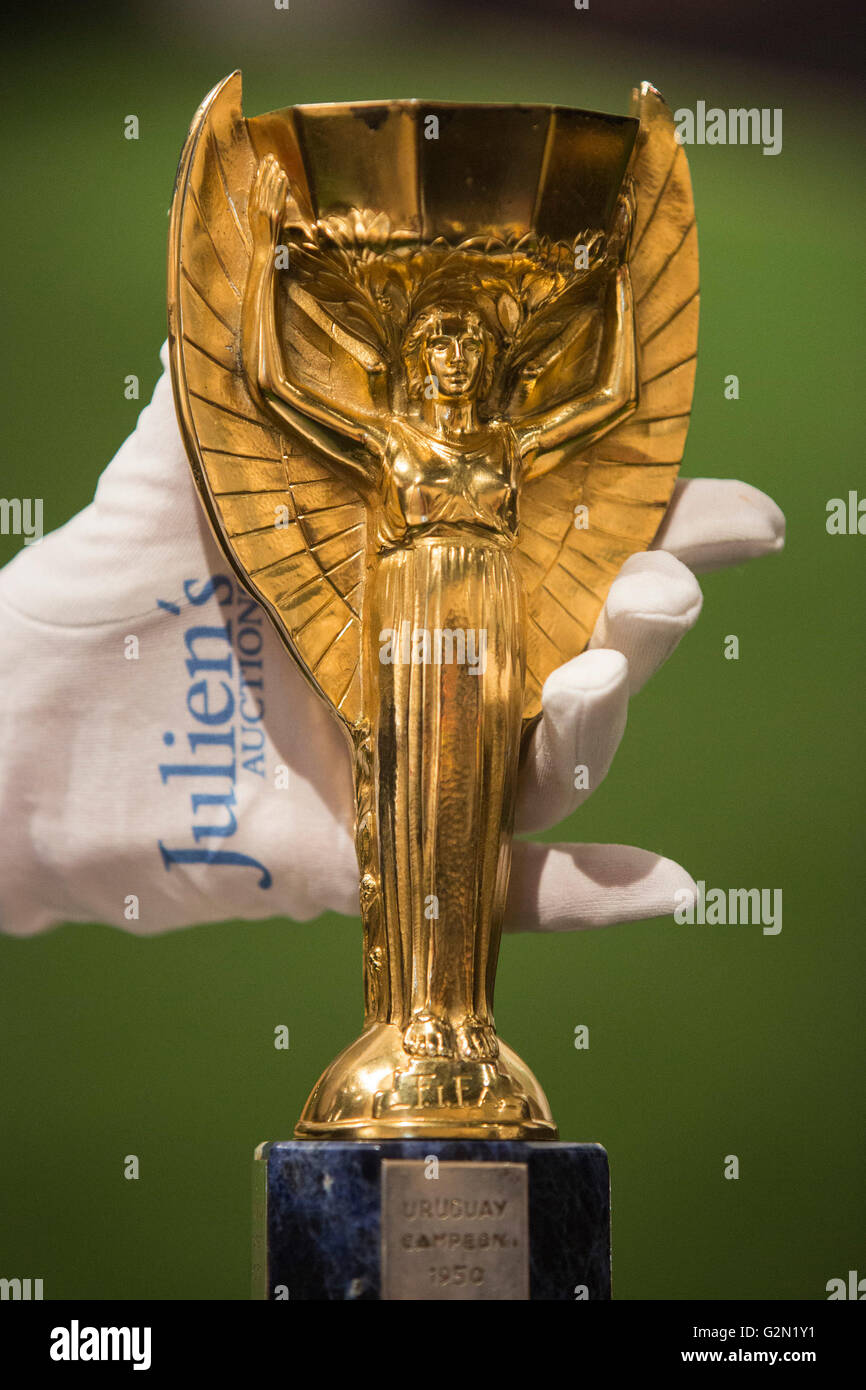 London, UK. 1 June 2016. Pele's replica of the Jules Rimet Cup. Press preview of Pele - The Collection, a sale run by Julien's Auctions at Mall Galleries. Highlights include Pele's Jules Rimet Trophy; 1958, 1962 and 1970 World Cup Medals; Santos FC game worn jerseys and boots; awards received while playing with Santos FC; his 1977 New York Cosmos NASL championship ring; FIFA Player of the Century Award; L'Equipe Athlete of the Century Award; 2007 FIFA President's Award and the torch used by Pele when he ran in the 2004 Summer Olympics Torch Relay. Stock Photo