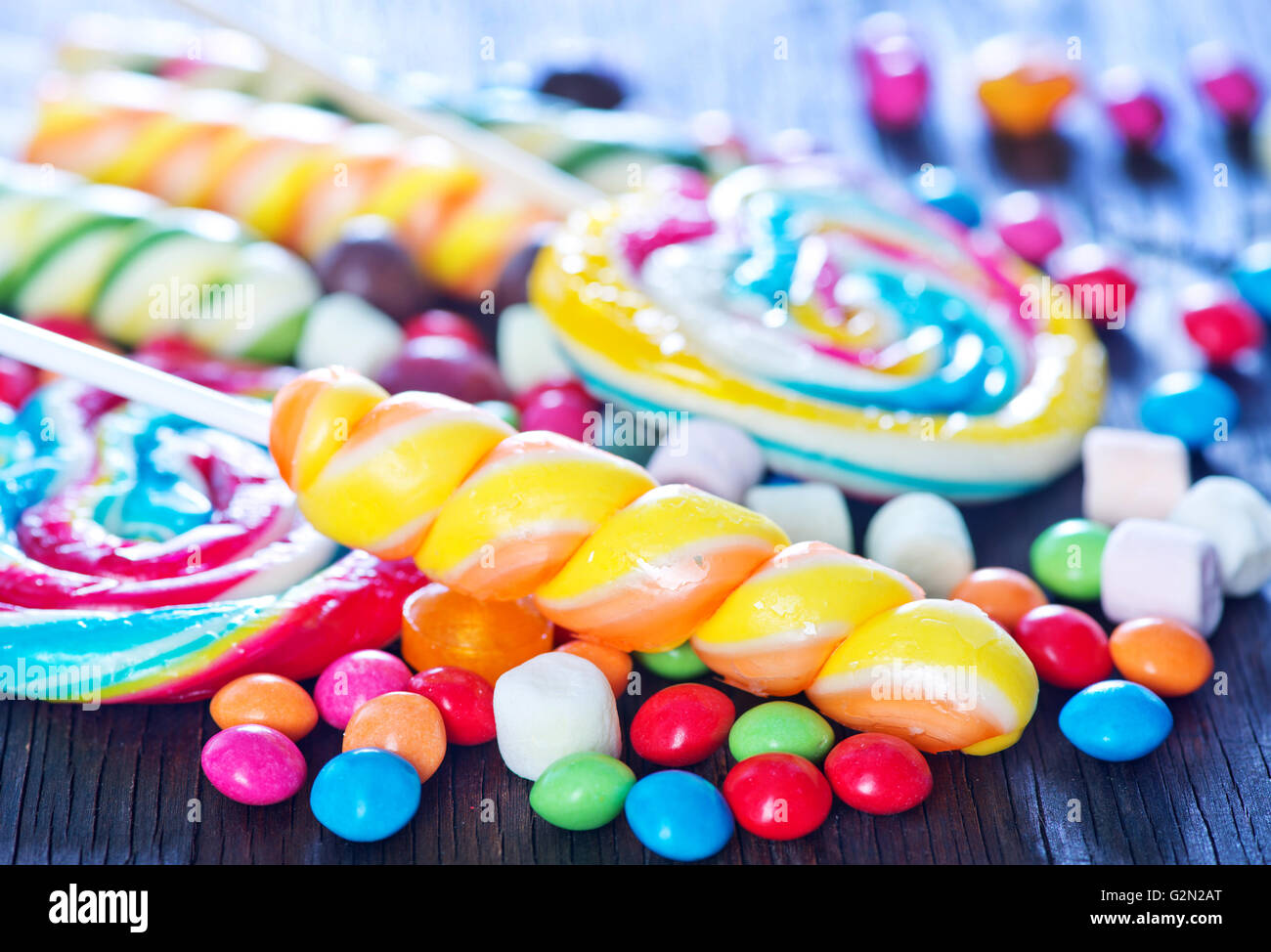 Color Candy sweet color candy on the wooden background Stock Photo - Alamy