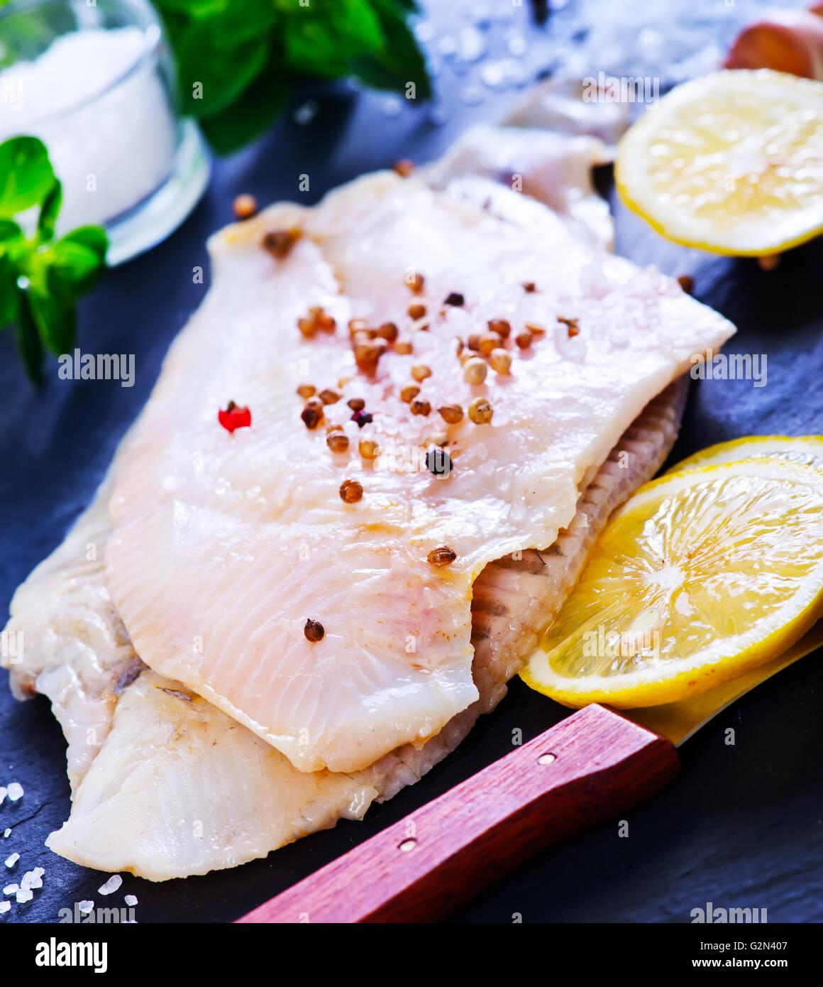 raw fish with aroma spice and fresh lemon Stock Photo Alamy