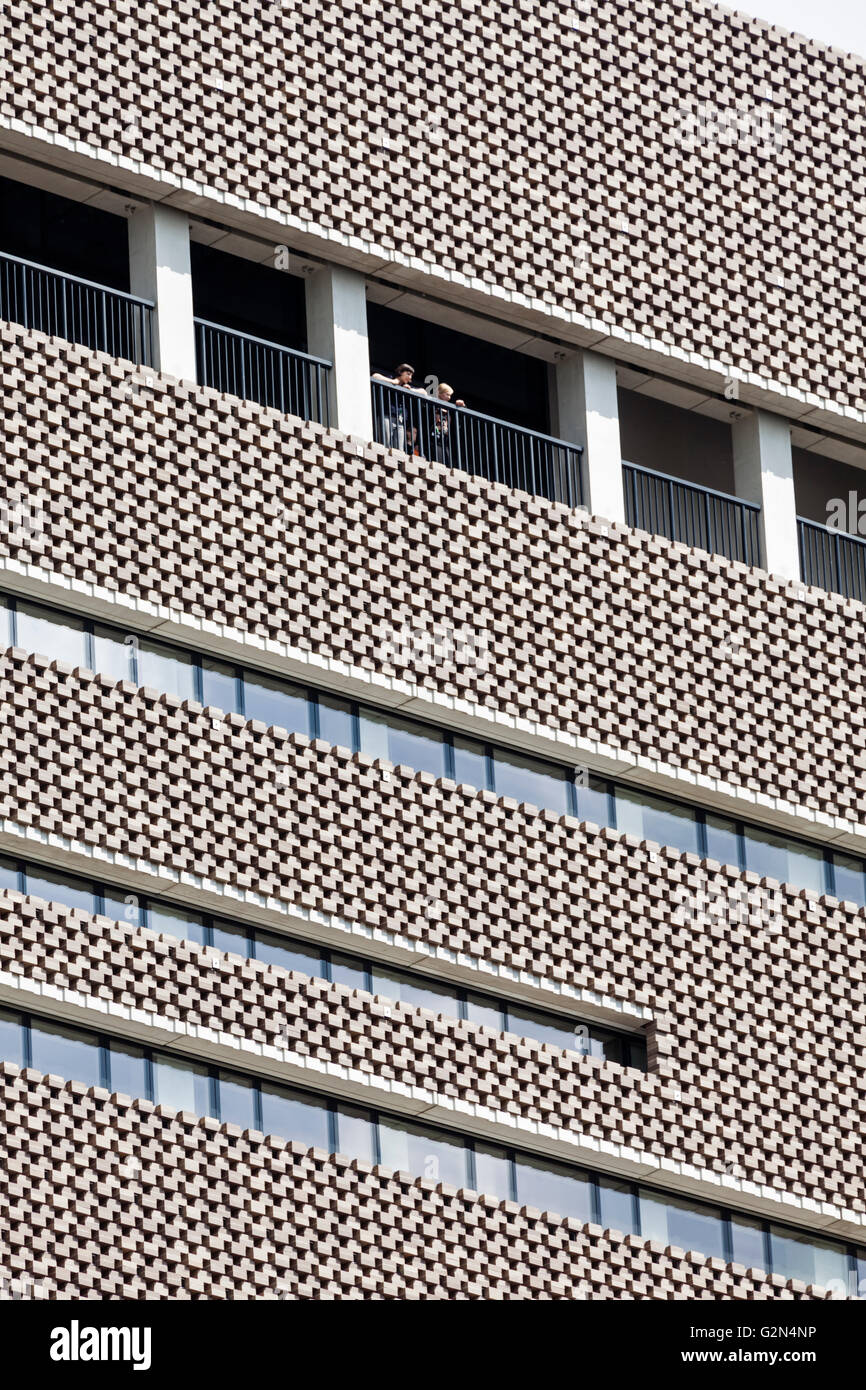 Tate Modern Switch House extension, Bankside, London. Visitors look out from an upper floor terrace. Stock Photo