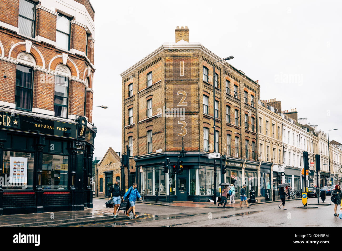 LONDON, UK AUGUST 23, 2015 People crossing Bethnal Green Road a