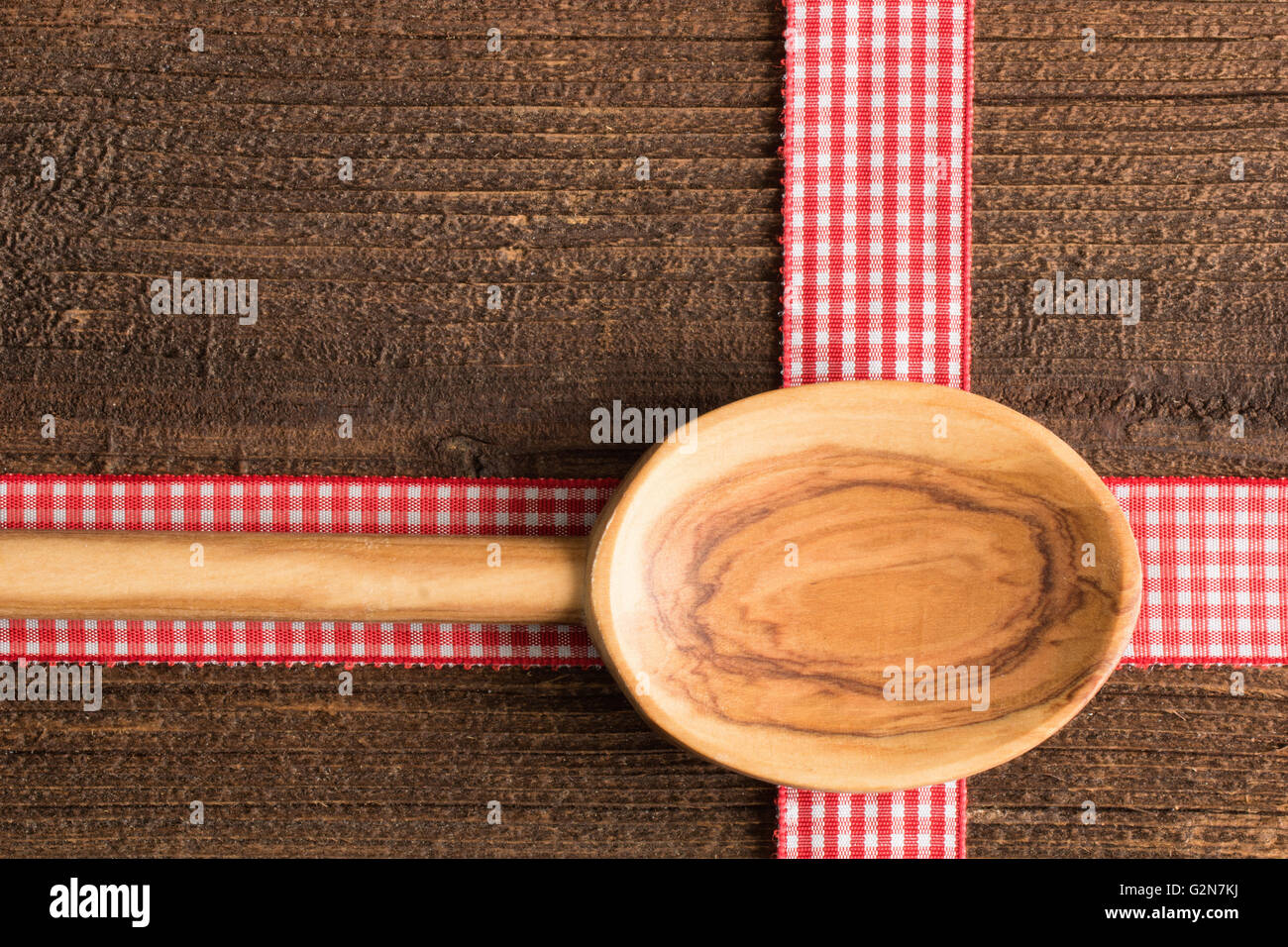 Rustic background with a wooden spoon on a rustic table Stock Photo