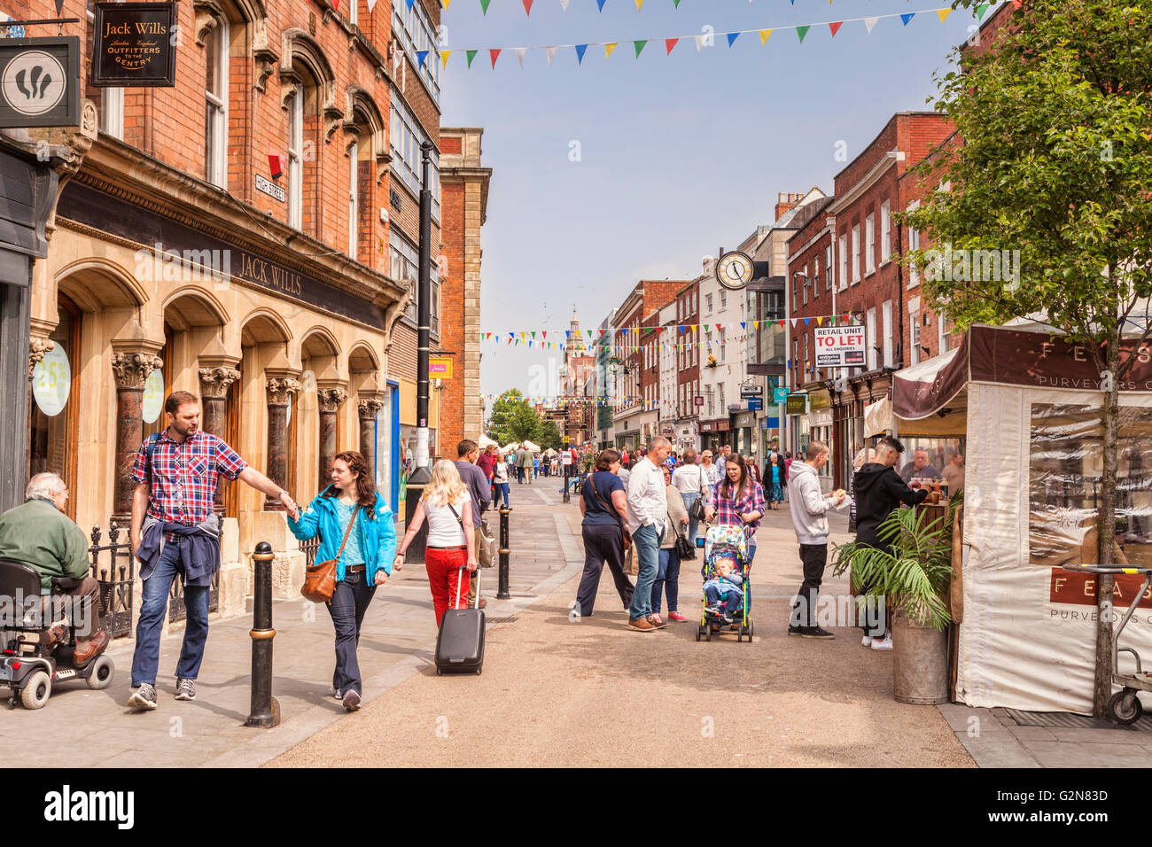 People shopping in Worcester High Street, Worcestershire, England, UK