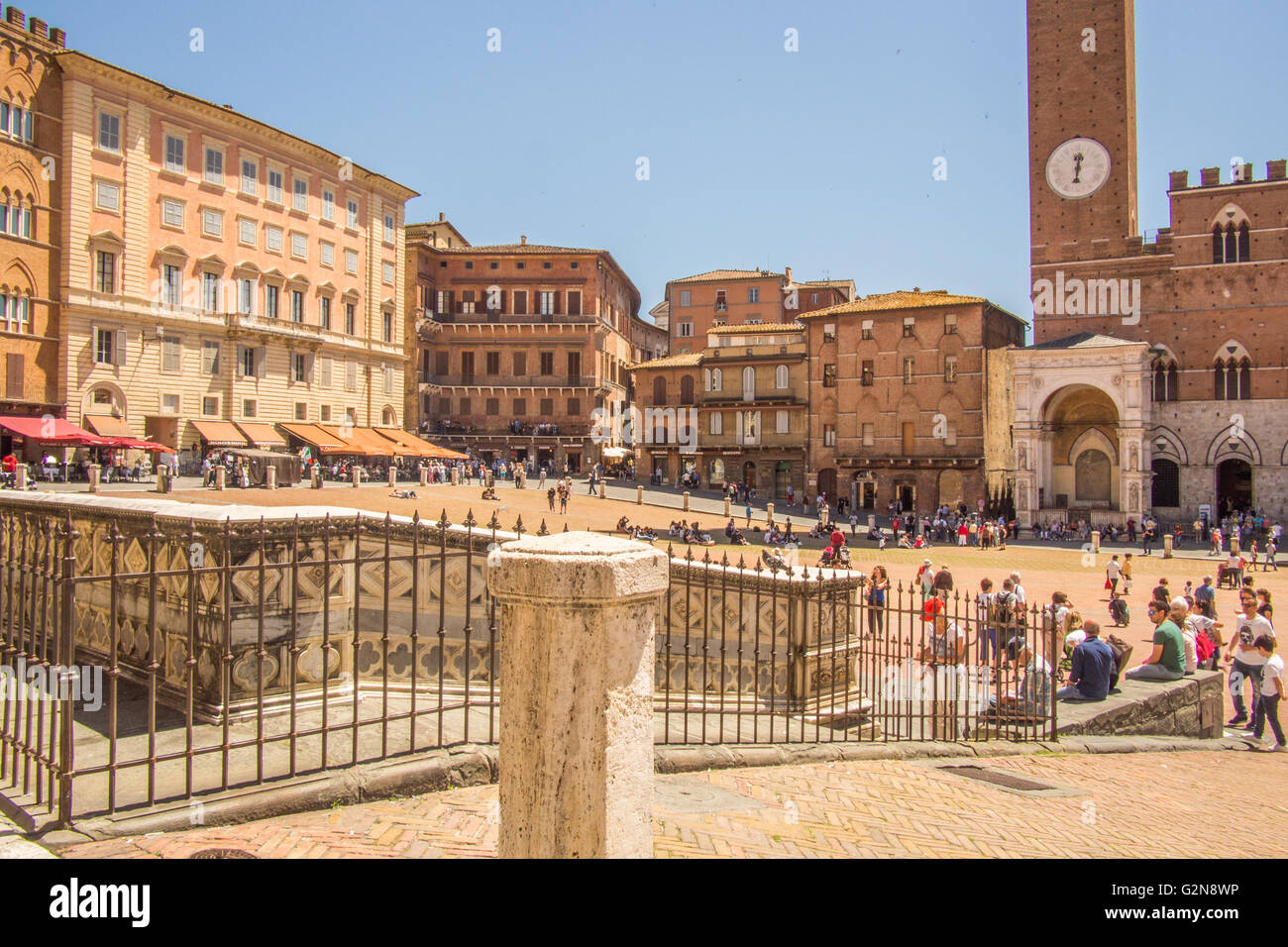 'Il Campo', a medieval Piazza in Siena, Tuscany, Italy The clock tower of the Palazzo Pubblico (town hall) is in picture. Stock Photo