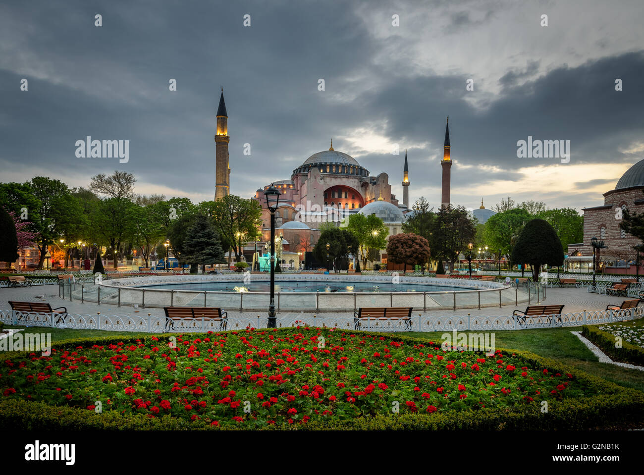 Hagia Sophia is seen behind tulips and fountain at Sultanahmet Square ...
