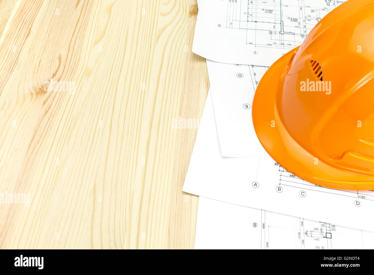 safety helmet with project drawings and construction blueprints Stock ...