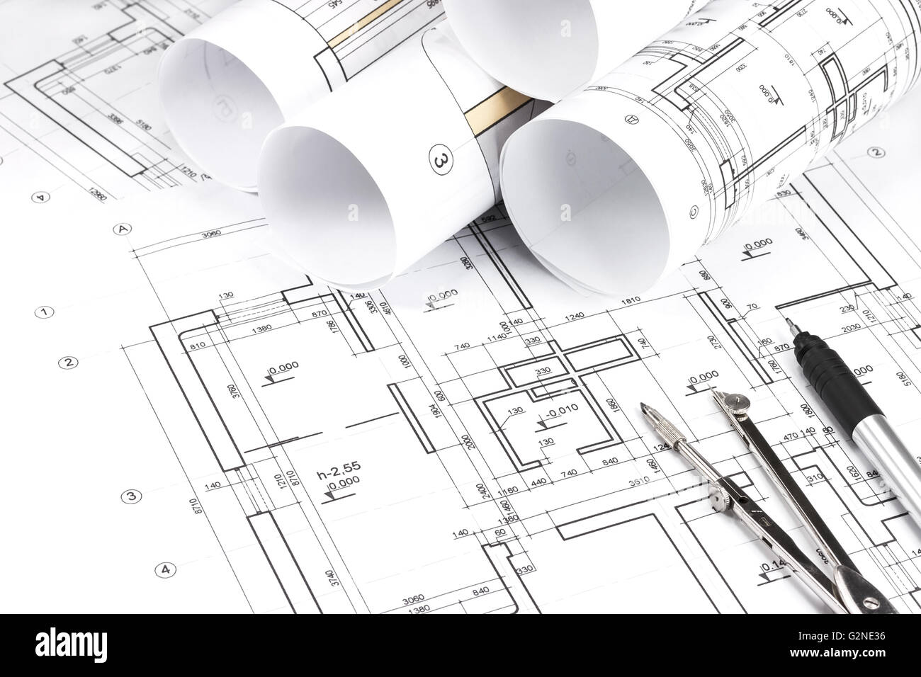 Architectural background with rolls of technical drawings and work tools  Stock Photo - Alamy
