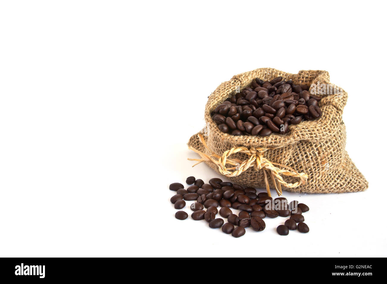 Coffee beans in canvas sack on white background Stock Photo - Alamy