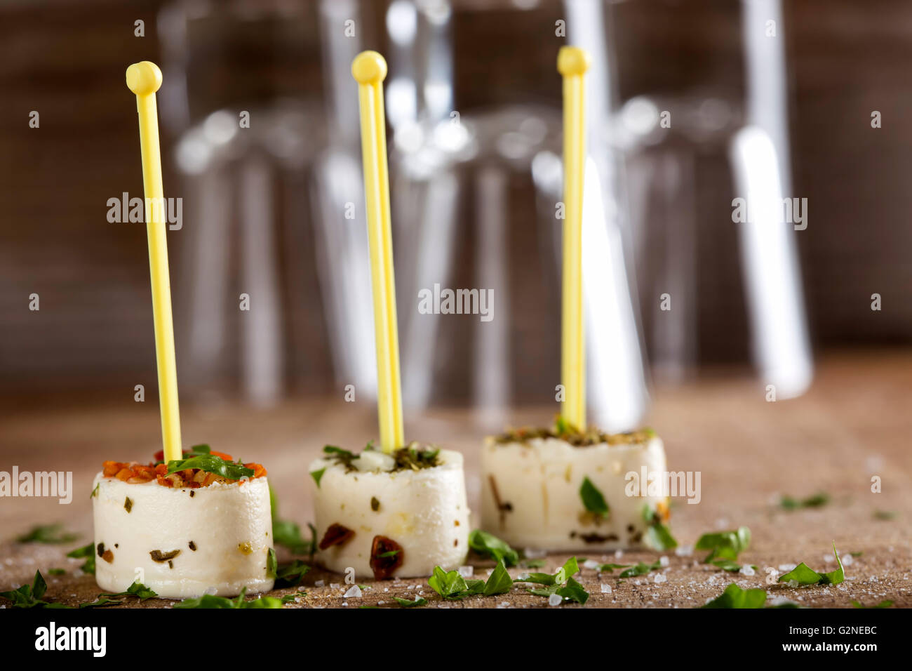Set of tasty canape on a wooden background with herbs Stock Photo