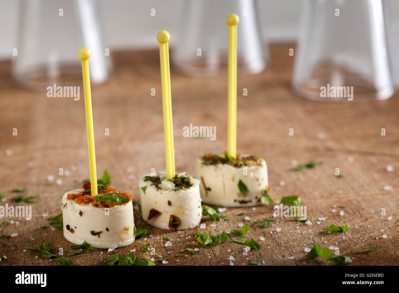 Set of tasty canape on a wooden background with herbs Stock Photo