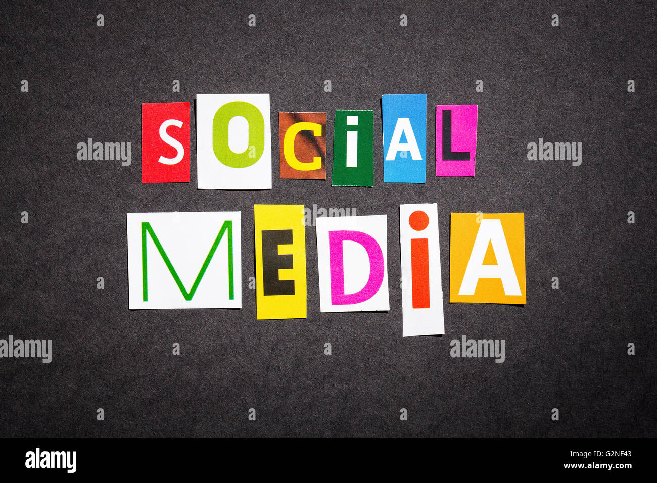 The colorful word social media in cut out magazine letters. Stock Photo