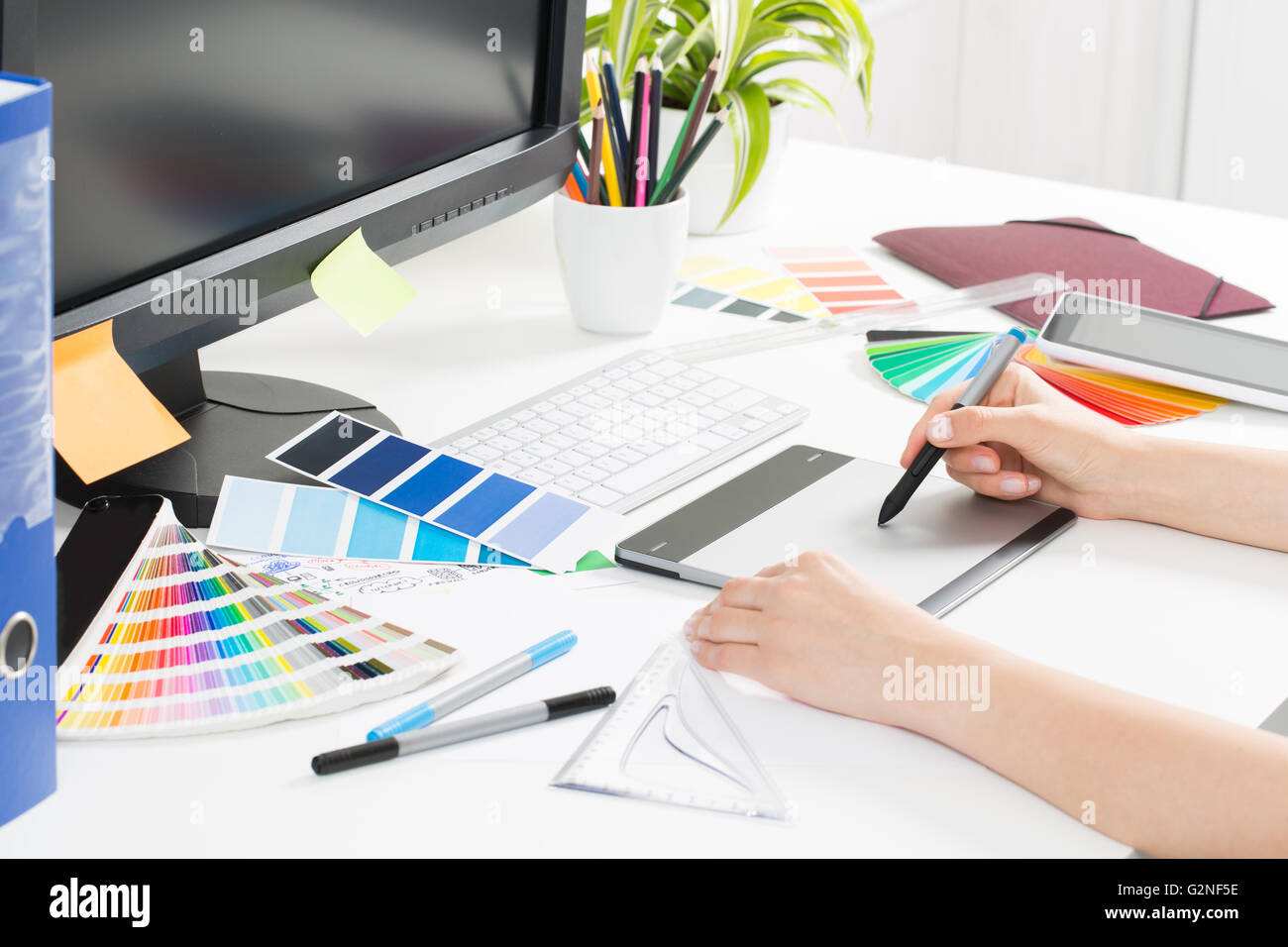 Graphic designer at work. Color swatch samples Stock Photo Alamy