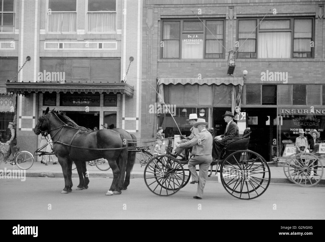 Horse and Buggy on a Main Street,Billings,Montana,USA,Arthur Rothstein for Farm Security Administration (FSA),August 1939 Stock Photo