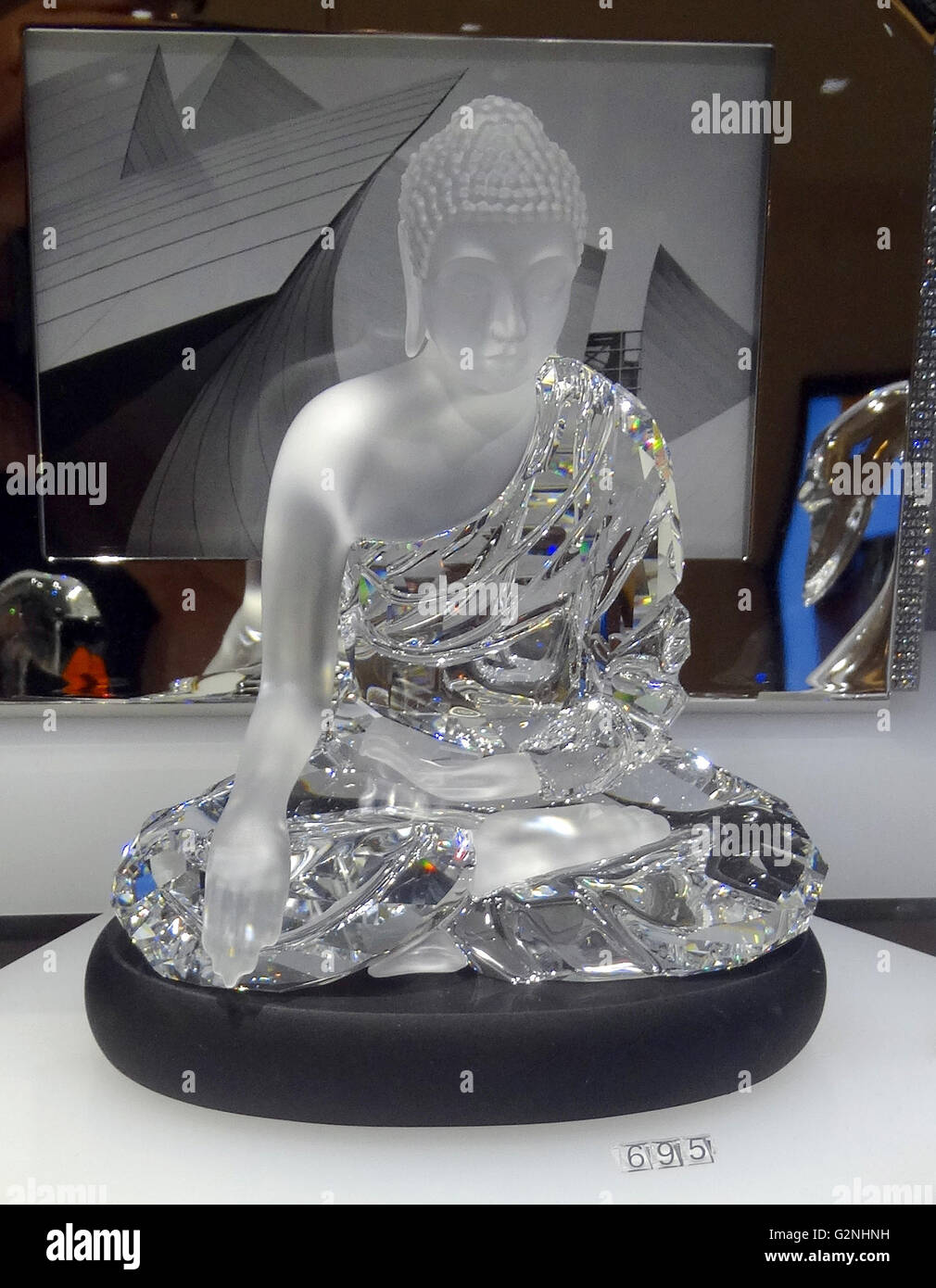 Swarovski Crystal Seated Buddha. Swarovski is an Austrian producer of  luxury cut lead glass. Founded by Daniel Swarovski (1862-1956). Dated 2014  Stock Photo - Alamy