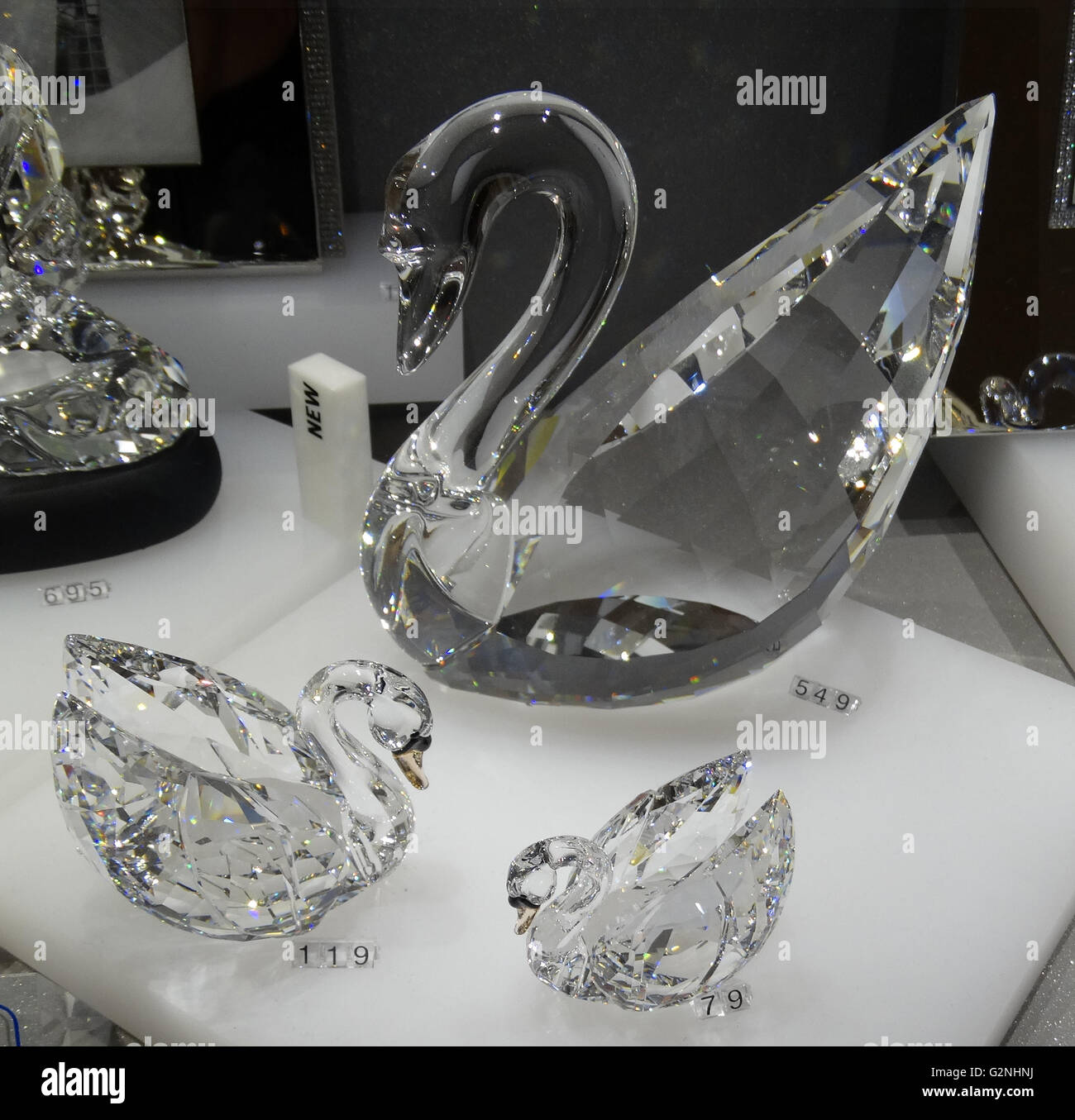 Collection of Swarovski Crystal Swans. Swarovski is an Austrian producer of  luxury cut lead glass. Founded by Daniel Swarovski (1862-1956). Dated 2014  Stock Photo - Alamy