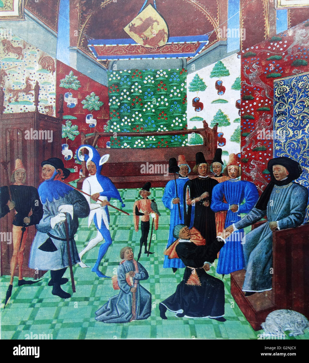 Illumination of the hall in the comte de Foix's castle at Orthez, capital of Bèarn. From Froissart's Chroniques de France et d'Angleterre. Jean Froissart is depicted before the Count, while the page behind carries the book Froissart is presenting. Dated 14th Century Stock Photo