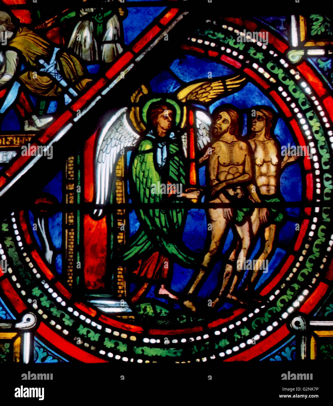 Stained glass from Sens Cathedral, France. Shows the expulsion of Adam and Eve from the Garden of Eden: 13th century Stock Photo