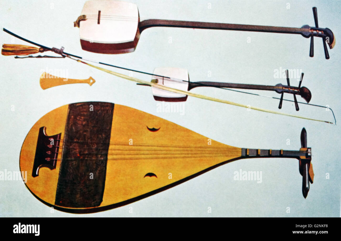 Siamisen, Kokiu, Biwa. These are all Japanese instruments. The Kokiu in the centre has a long fishing-rod bow, the Siamisen is the most common Japanese stringed instrument and the Biwa is a lute-like instrument in the shape of a divided pear that becomes narrower as it goes upwards. Stock Photo