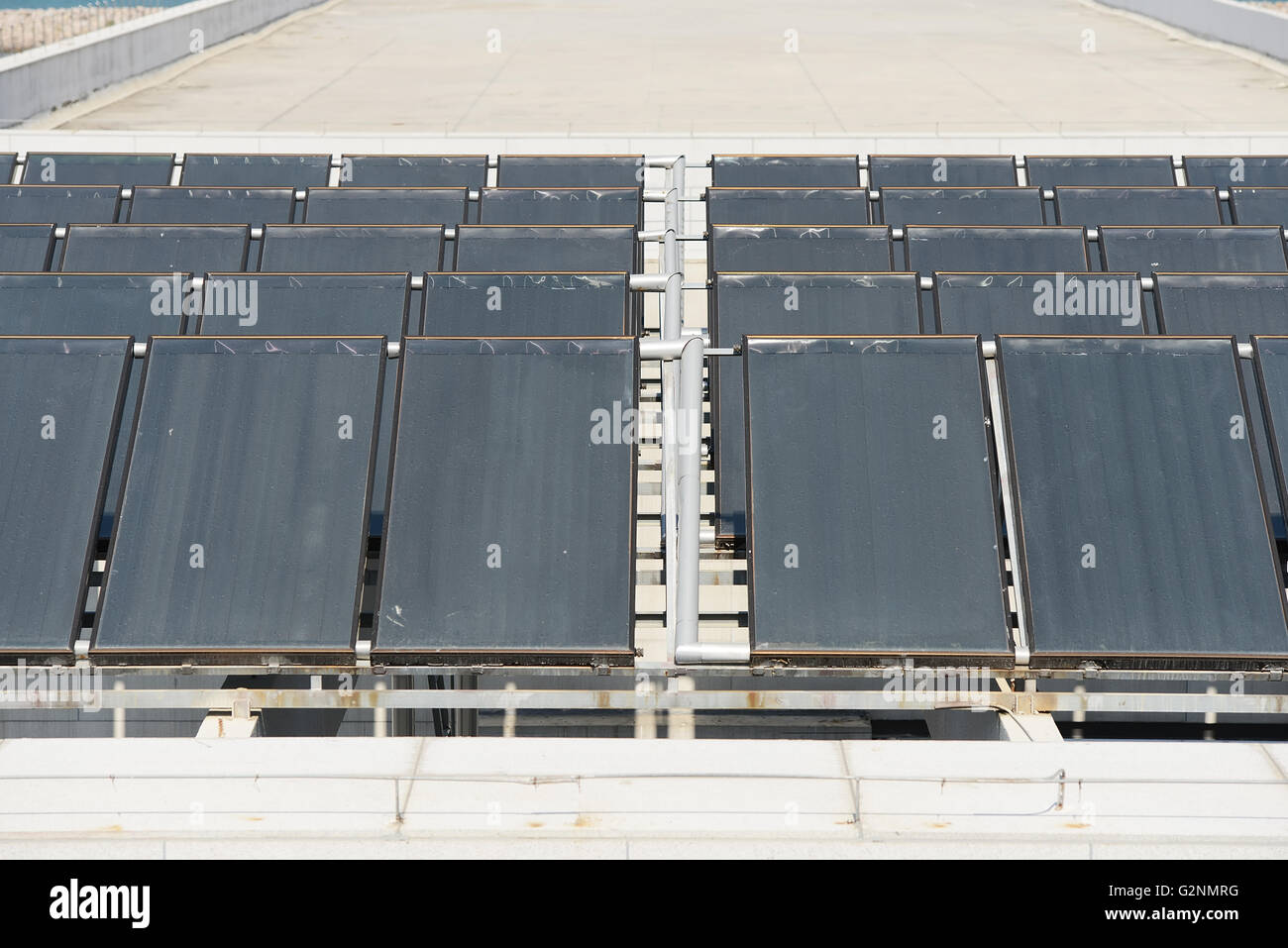 Solar water heating panel on a house roof Stock Photo