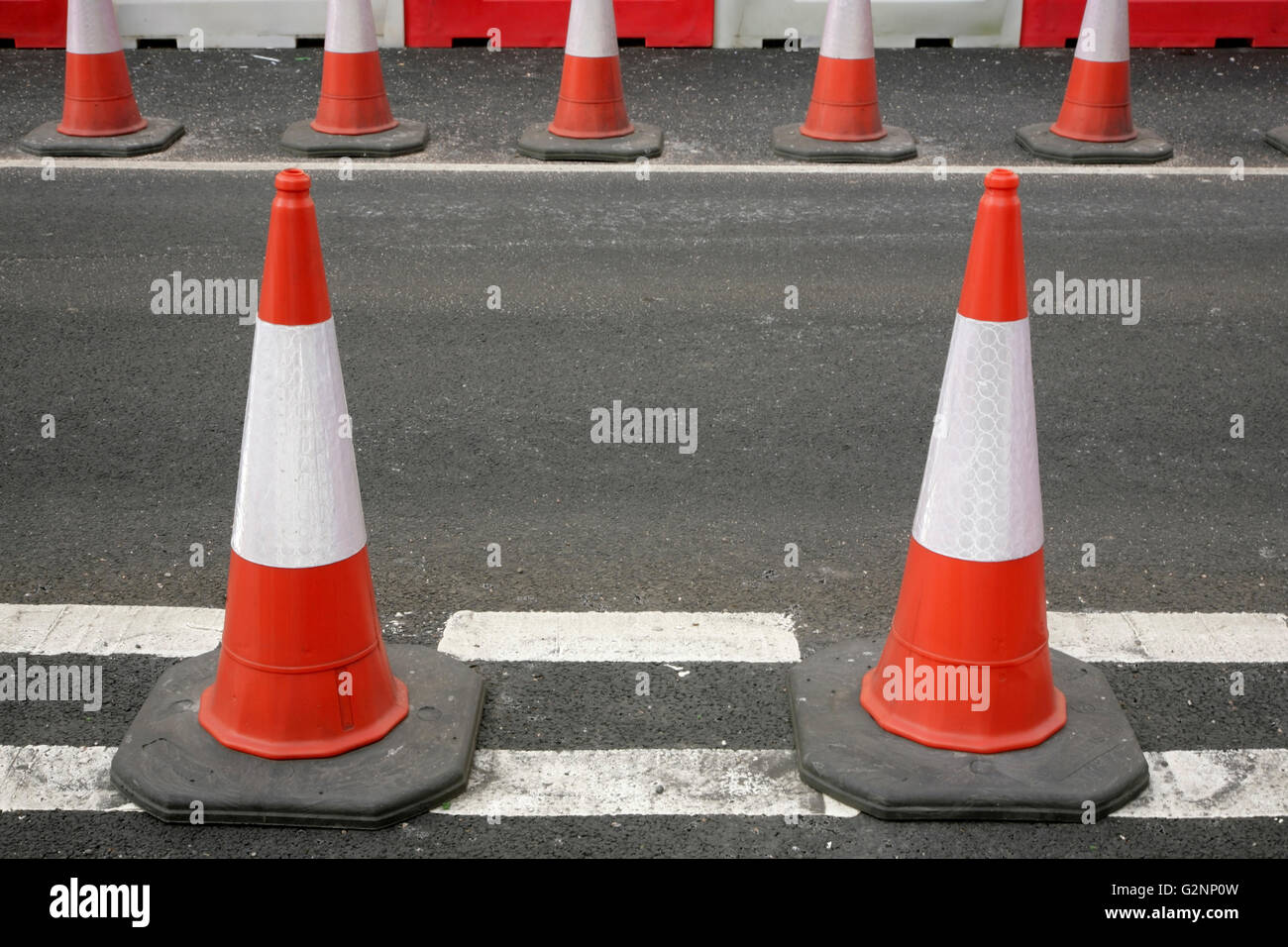 Traffic cones at give way lines at section of roadworks. Stock Photo