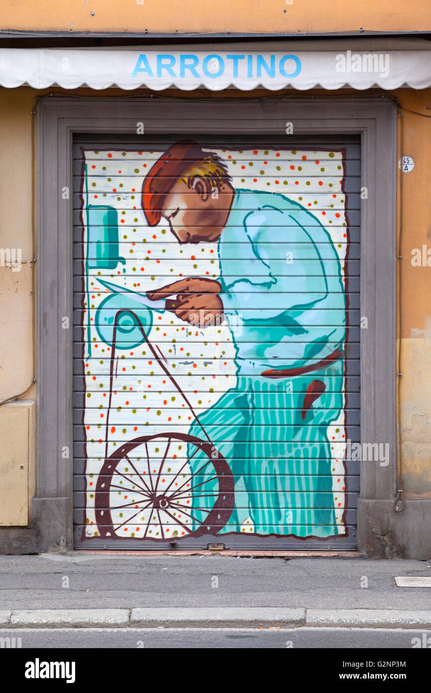 A mural art on the facade of a knife grinder shop in Bologna, Emilia