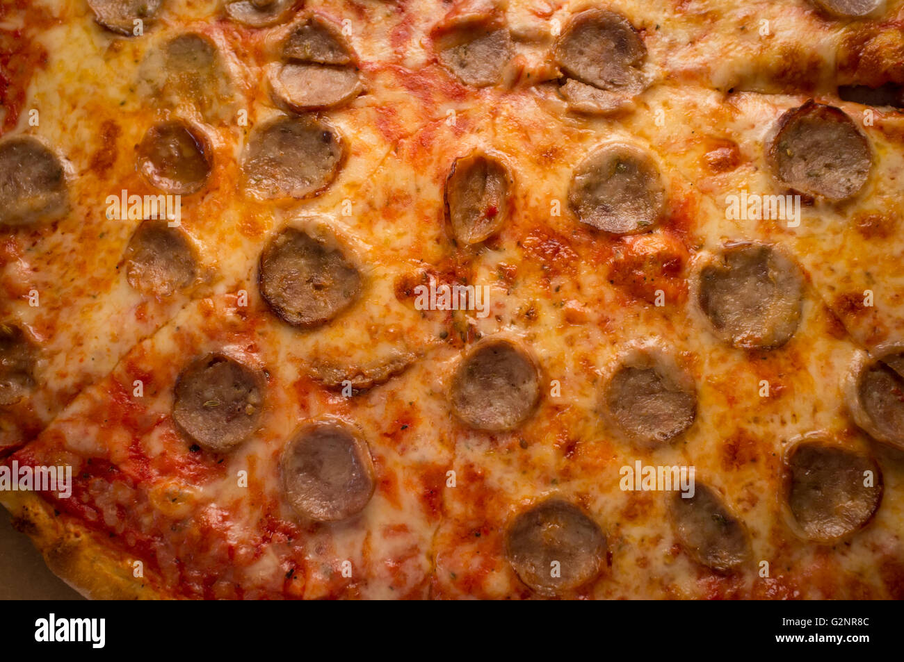 Large slices of sausage and cheese pizza New York style Stock Photo - Alamy