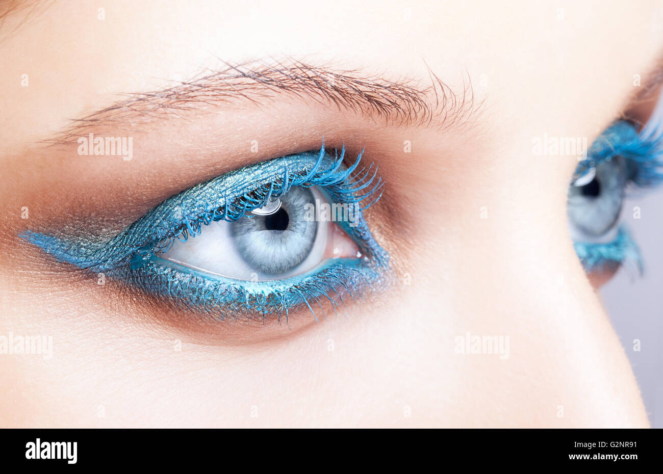 Close-up shot of female eyes blue color make-up Stock Photo