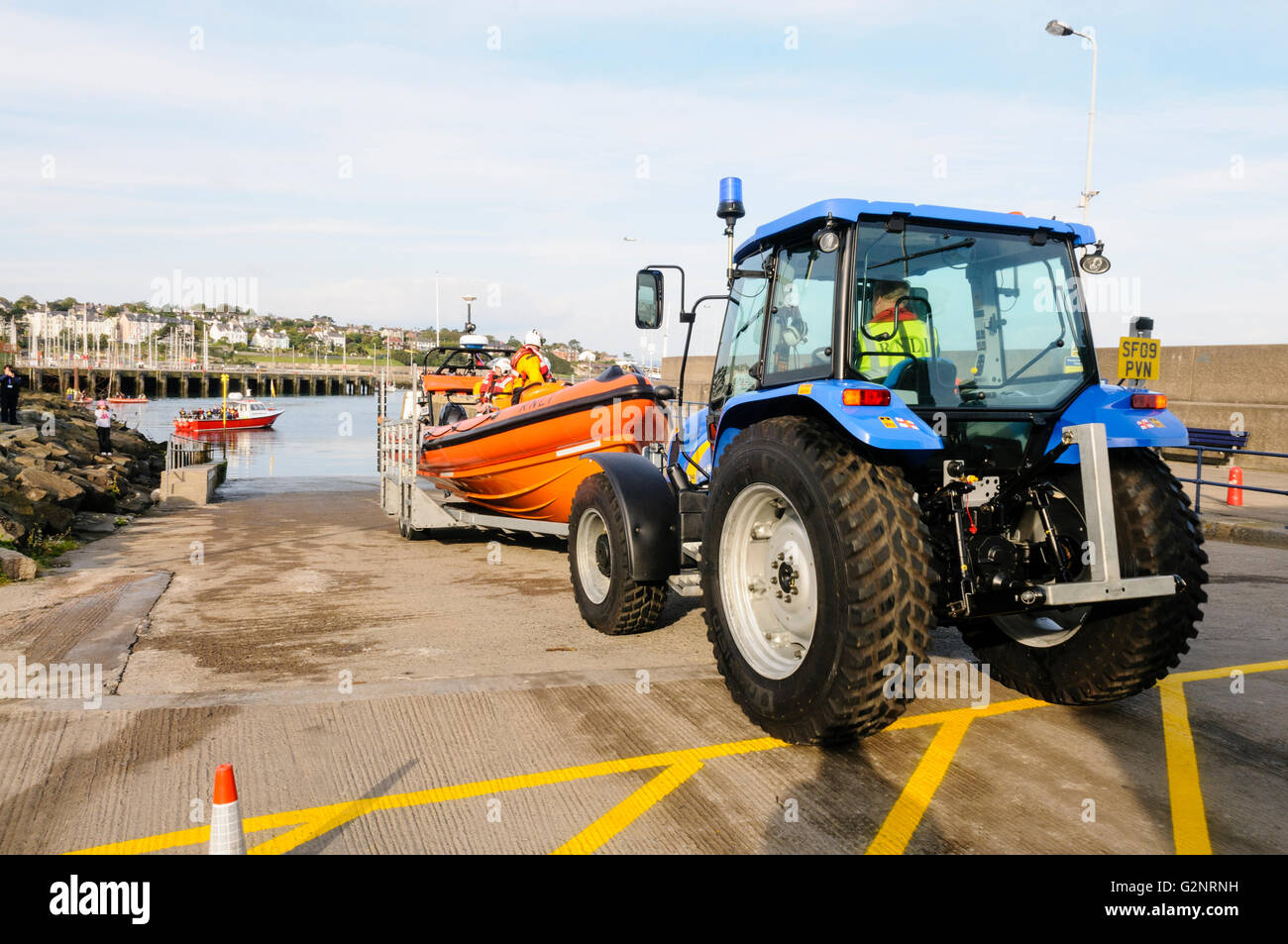 Bangor, County Down. 23/09/2012 - Bangor RNLI lifeboat is launched using a tractor to lower it safely down the slipway. Stock Photo