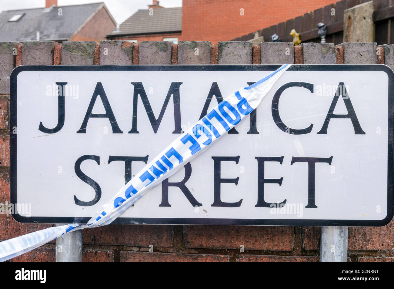 Belfast, 04/10/2012 - PSNI tape is used to close Jamaica Street in the Ardoyne area of Belfast in a police operation Stock Photo