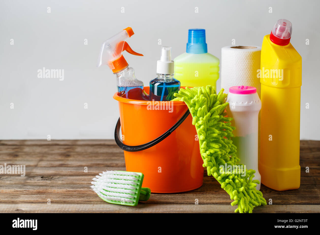 Bucket with cleaning items on light background Stock Photo