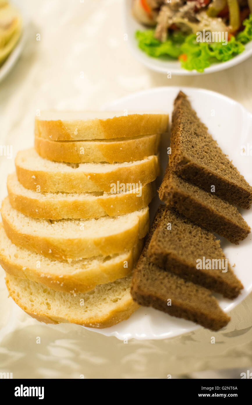 White and grey fresh bread on plate Stock Photo - Alamy