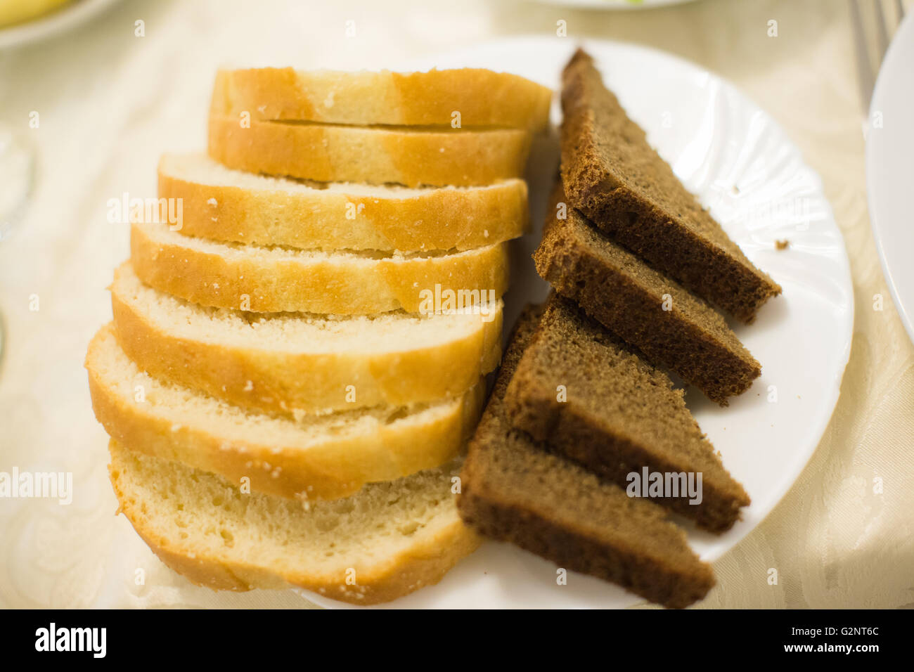 White and grey fresh bread on plate Stock Photo - Alamy