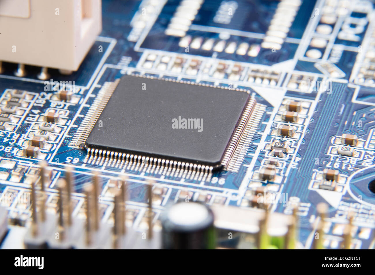 Electronic circuit board close up. Blue PCB Stock Photo