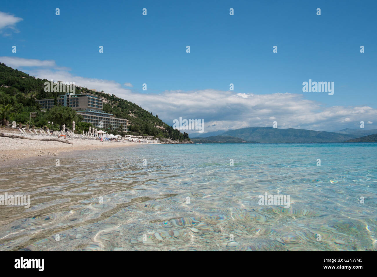 Krouzeri Beach, Corfu. In the photo is the Nissaki Beach Hotel Stock Photo