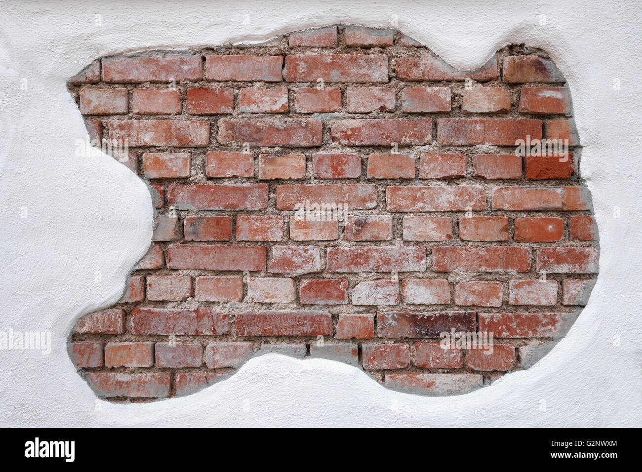 Partially plastered, old, dirty brick wall Stock Photo