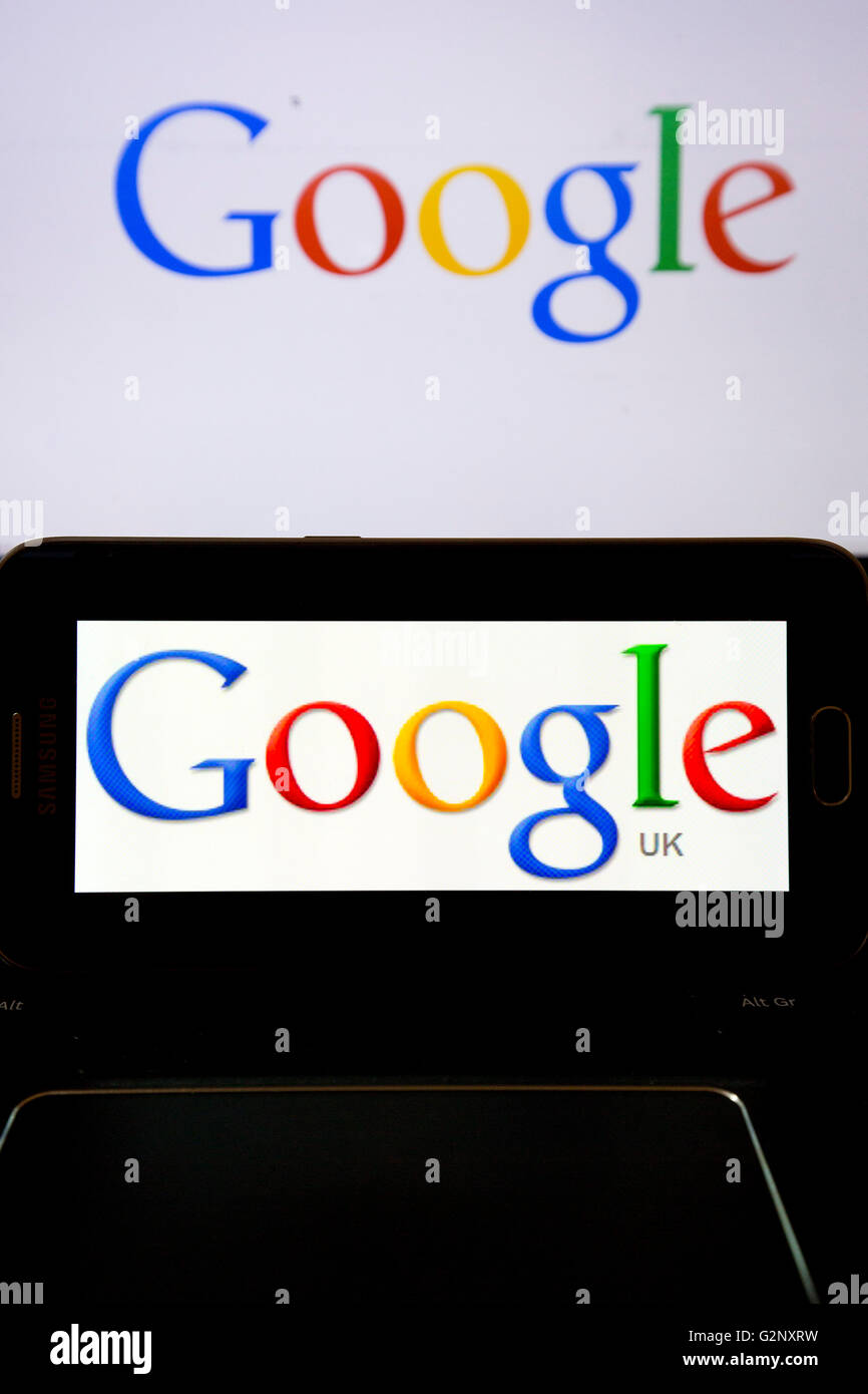 Google UK search engine logos are pictured on phone and laptop screens