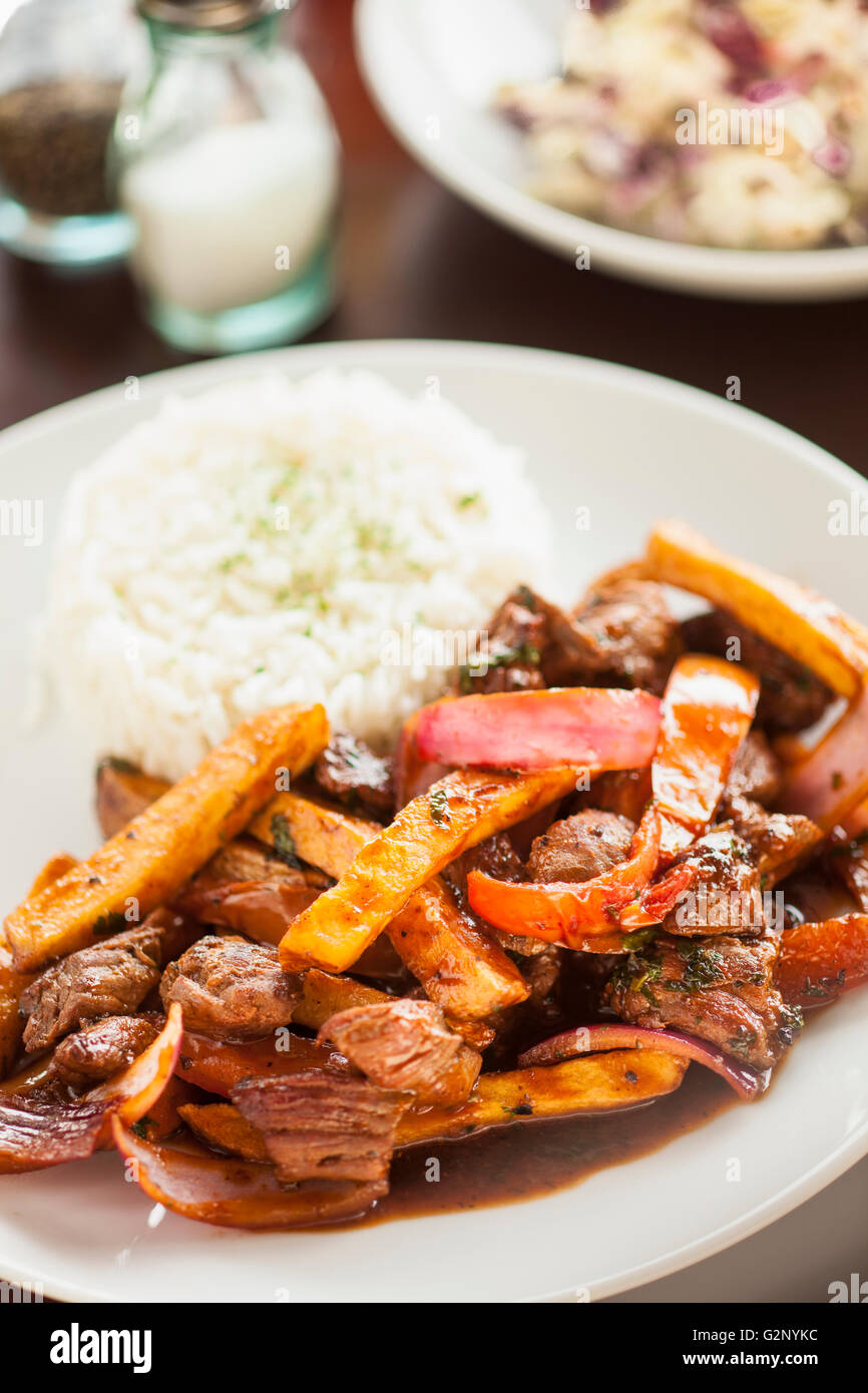 lomo saltado with rice and a side of  tropical slaw, Mouthful Eatery, Thousand Oaks, California Stock Photo