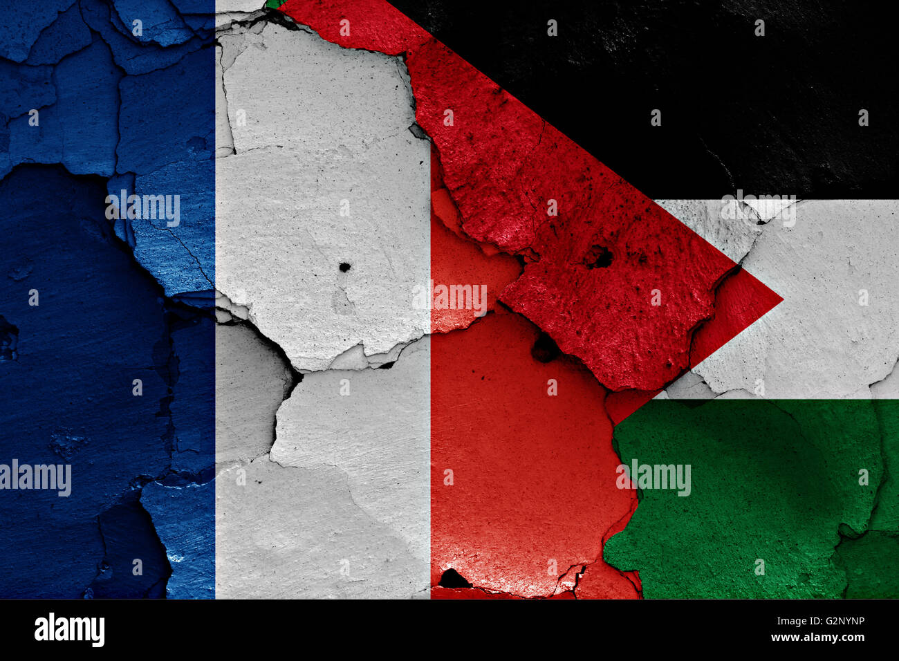 flags of France and Palestine painted on cracked wall Stock Photo